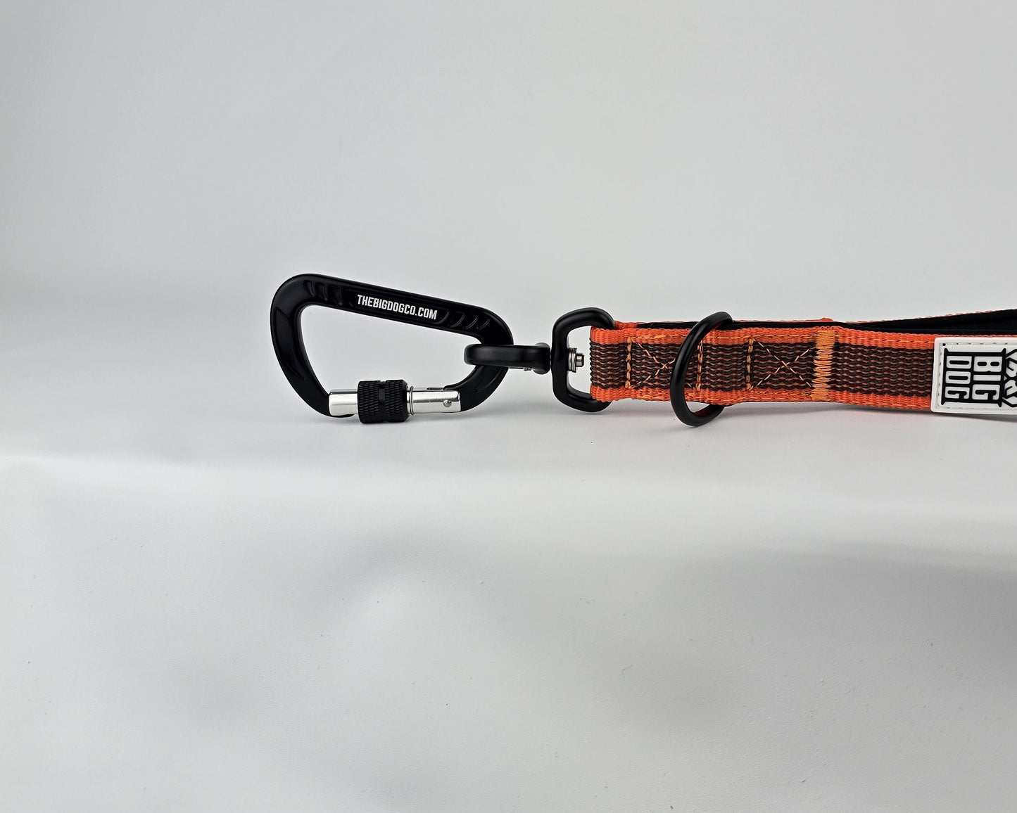 Orange and black dog traffic handle with The Big Dog Company logo on a white background. Heavy duty. Nylon, rubber, neoprene.