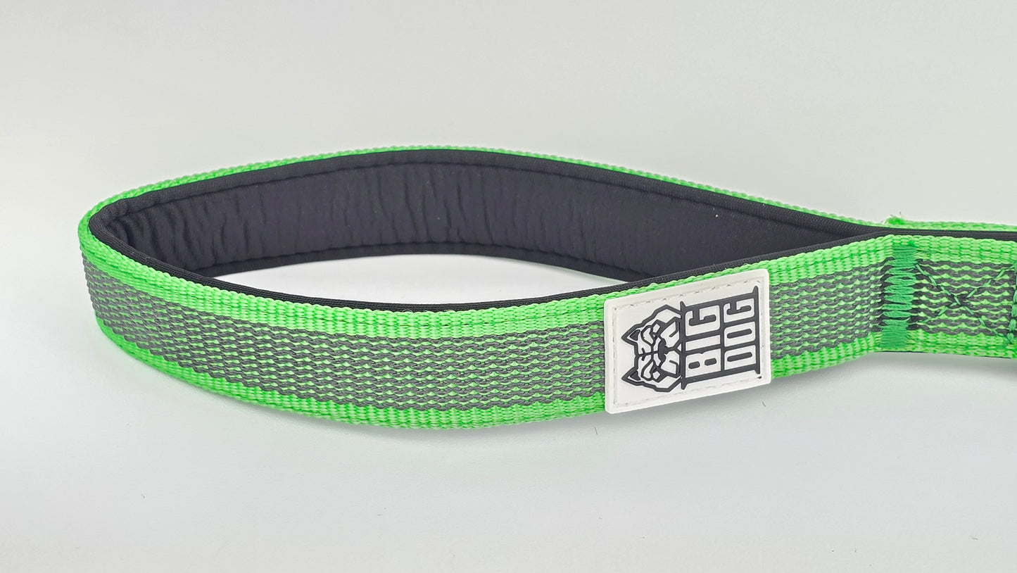 Green and black dog traffic handle with The Big Dog Company logo on a white background. Heavy duty. Nylon, rubber, neoprene.