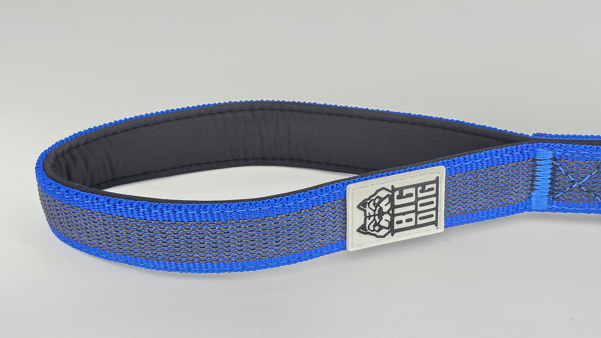 Blue and black dog handle with a The Big Dog Company logo. Neoprene, rubber, nylon. Heavy duty, high quality. 