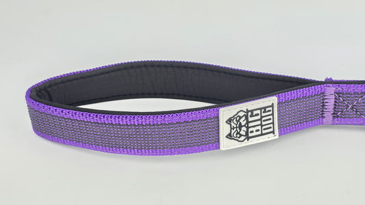 Purple and black dog handle with a The Big Dog Company logo. Neoprene, rubber, nylon. Heavy duty, high quality. 
