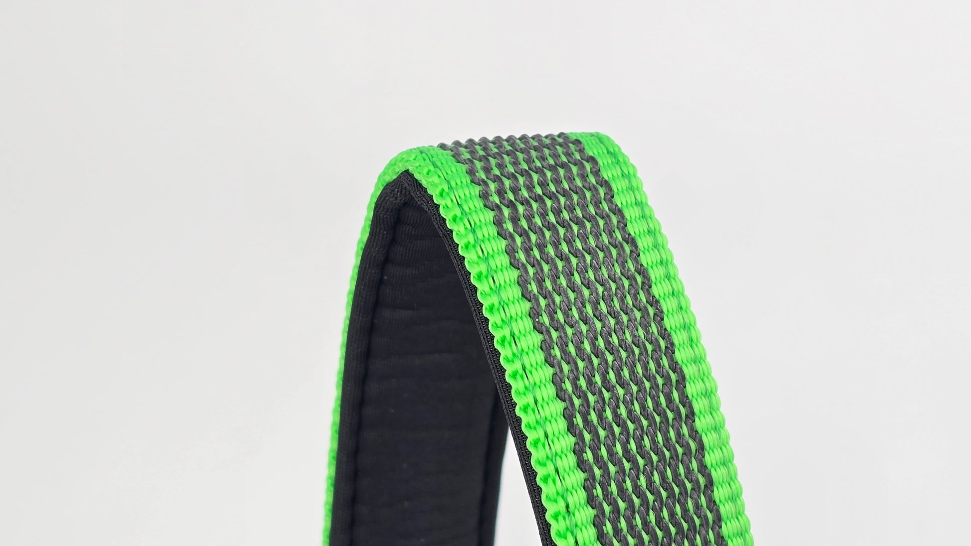 Green and black dog traffic handle with The Big Dog Company logo on a white background. Heavy duty. Nylon, rubber, neoprene.