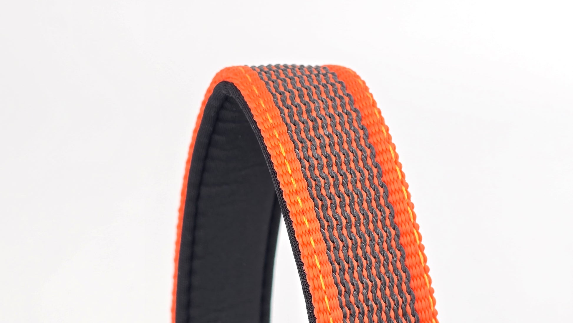Orange and black dog traffic handle with The Big Dog Company logo on a white background. Heavy duty. Nylon, rubber, neoprene.
