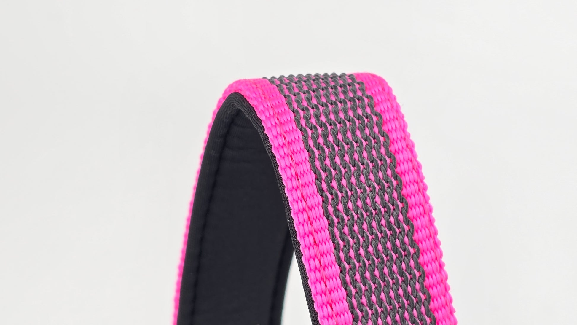 Pink and black dog traffic handle with The Big Dog Company logo on a white background. Heavy duty. Nylon, rubber, neoprene.