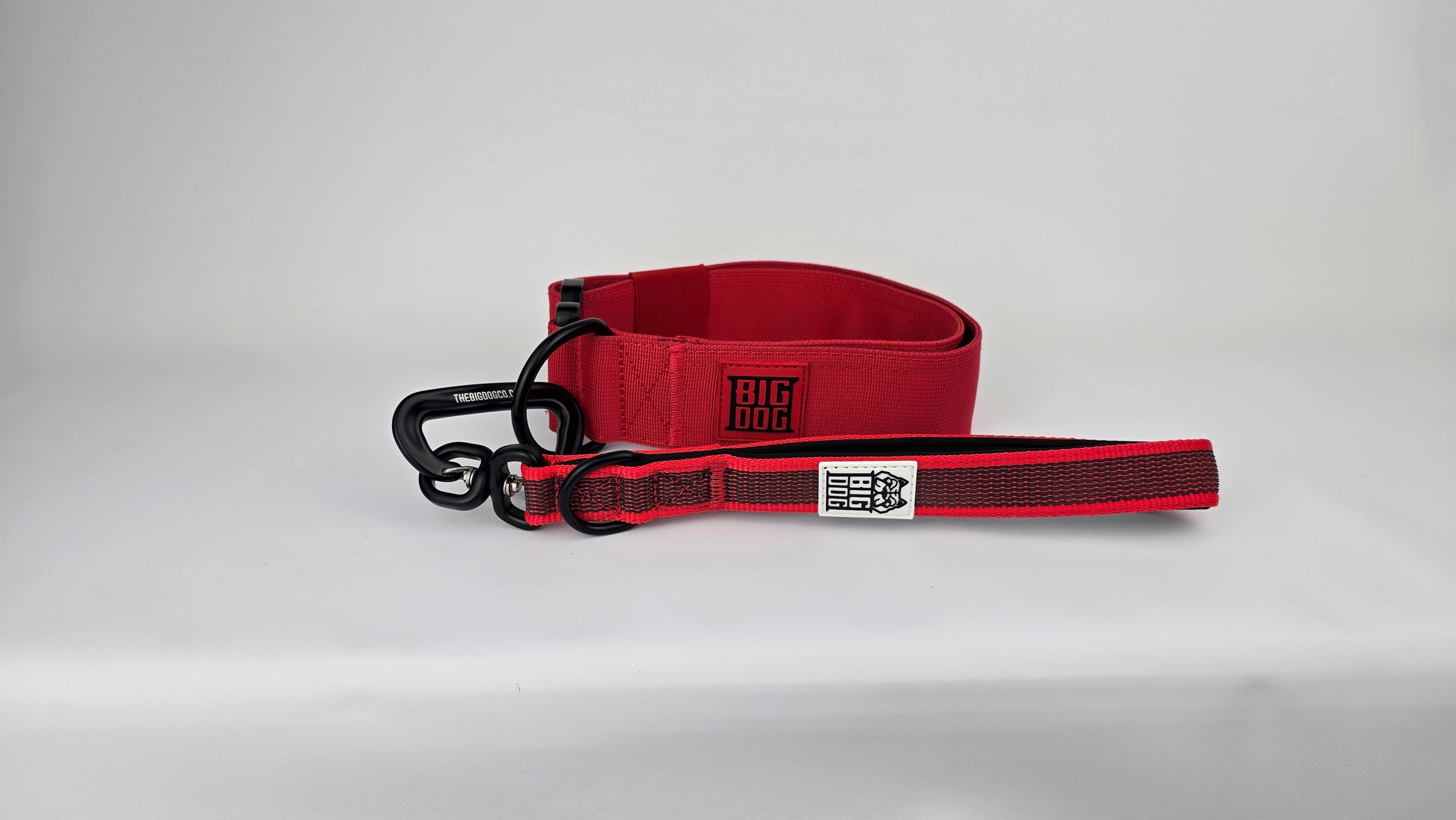 Red and black dog handle with a The Big Dog Company logo. Neoprene, rubber, nylon. Heavy duty, high quality. With Red Heavy duty 2 inch dog collar. 