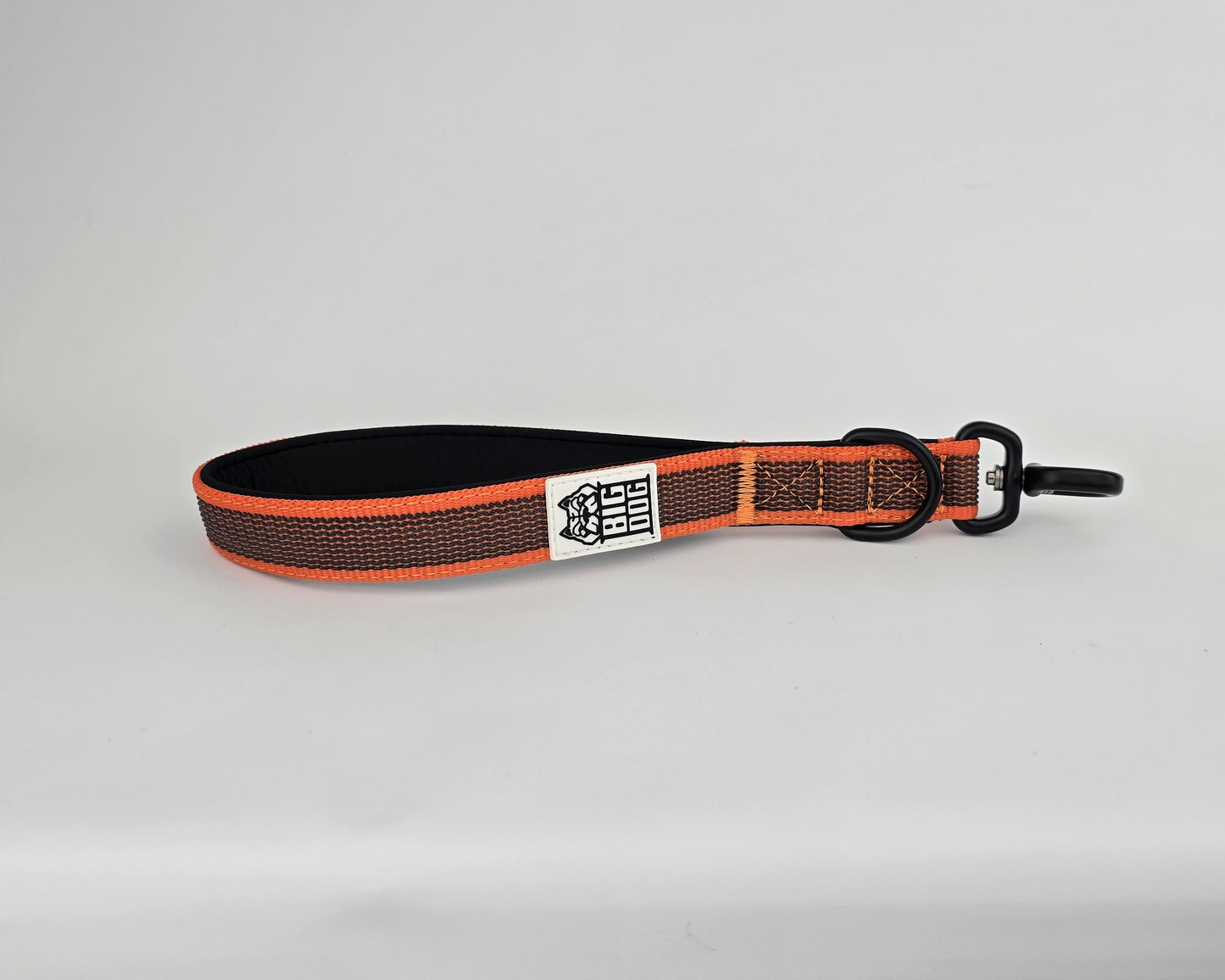 Orange and black dog traffic handle with The Big Dog Company logo on a white background. Heavy duty. Nylon, rubber, neoprene.