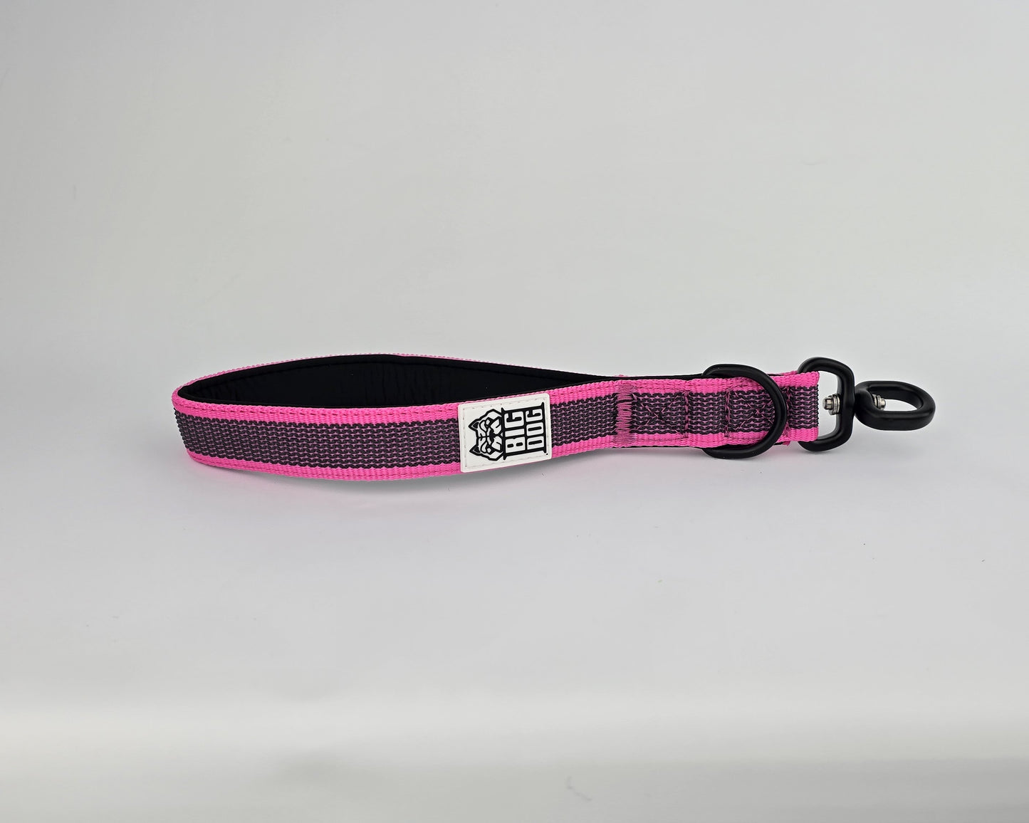 Pink and black dog traffic handle with The Big Dog Company logo on a white background. Heavy duty. Nylon, rubber, neoprene.