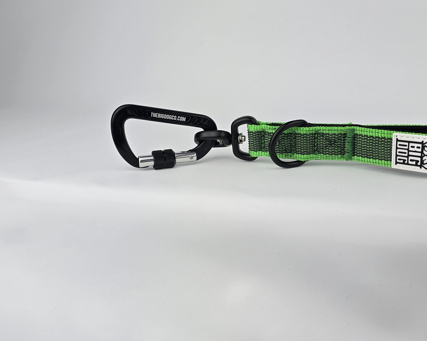 Green and black dog traffic handle with The Big Dog Company logo on a white background. Heavy duty. Nylon, rubber, neoprene.