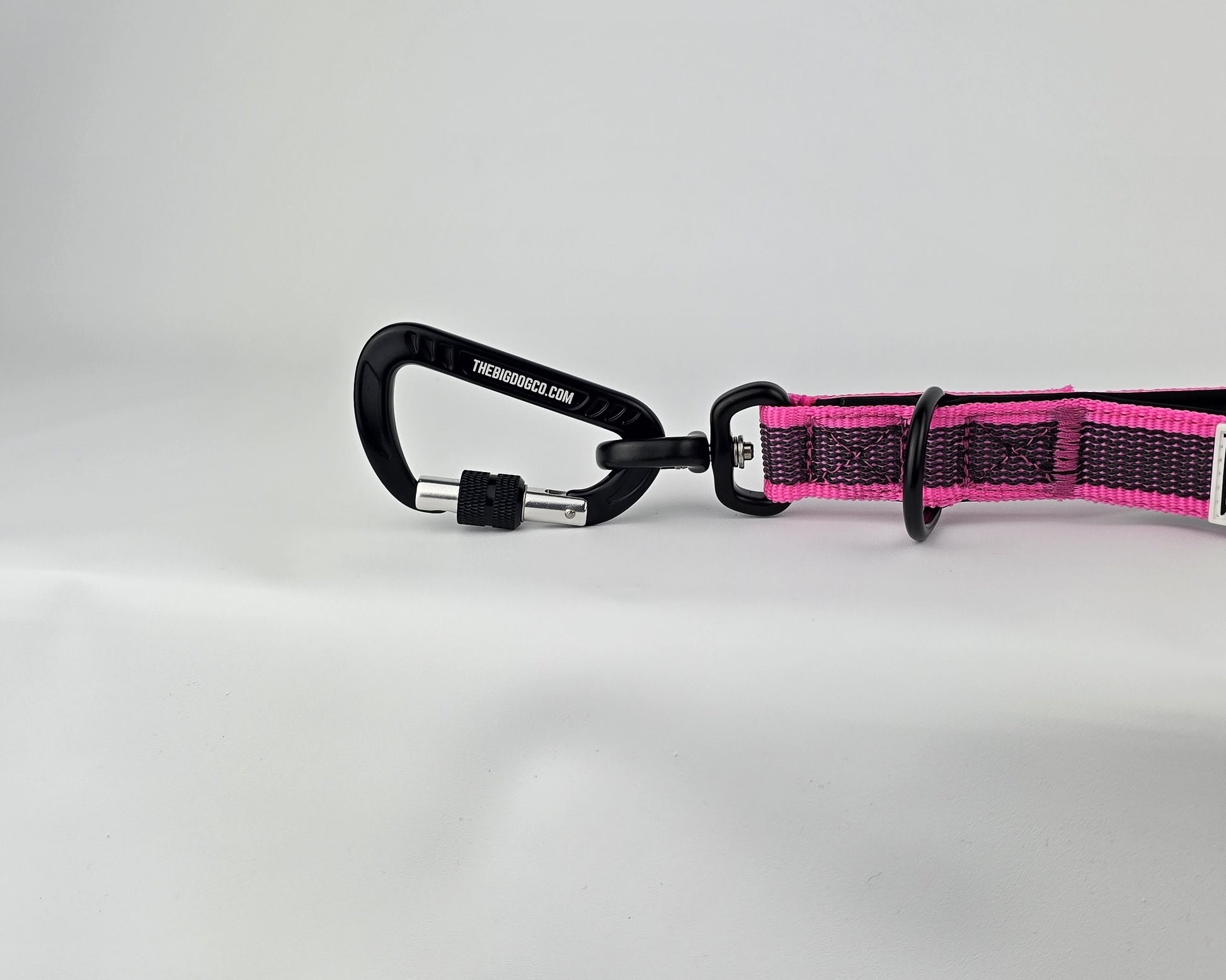 Pink and black dog traffic handle with The Big Dog Company logo on a white background. Heavy duty. Nylon, rubber, neoprene.