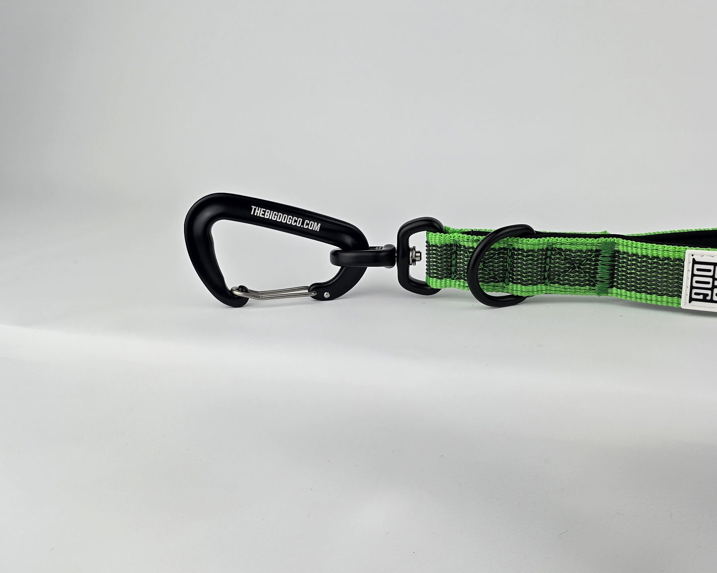 Green and black dog traffic handle with The Big Dog Company logo on a white background. Heavy duty. Nylon, rubber, neoprene.
