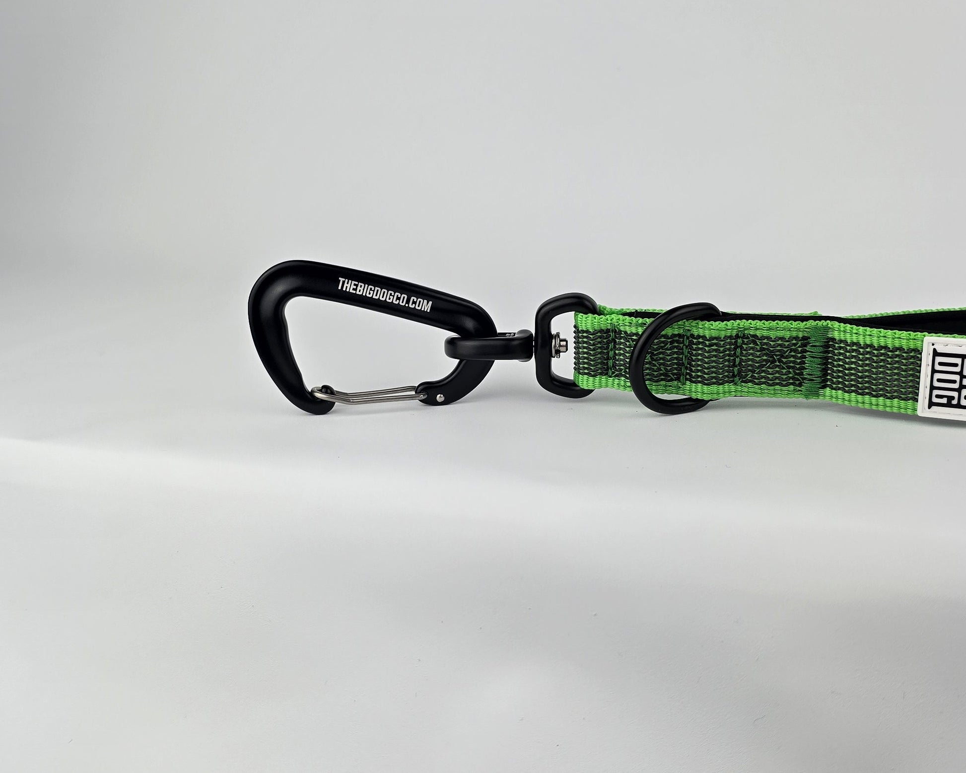 Green and black dog traffic handle with The Big Dog Company logo on a white background. Heavy duty. Nylon, rubber, neoprene.