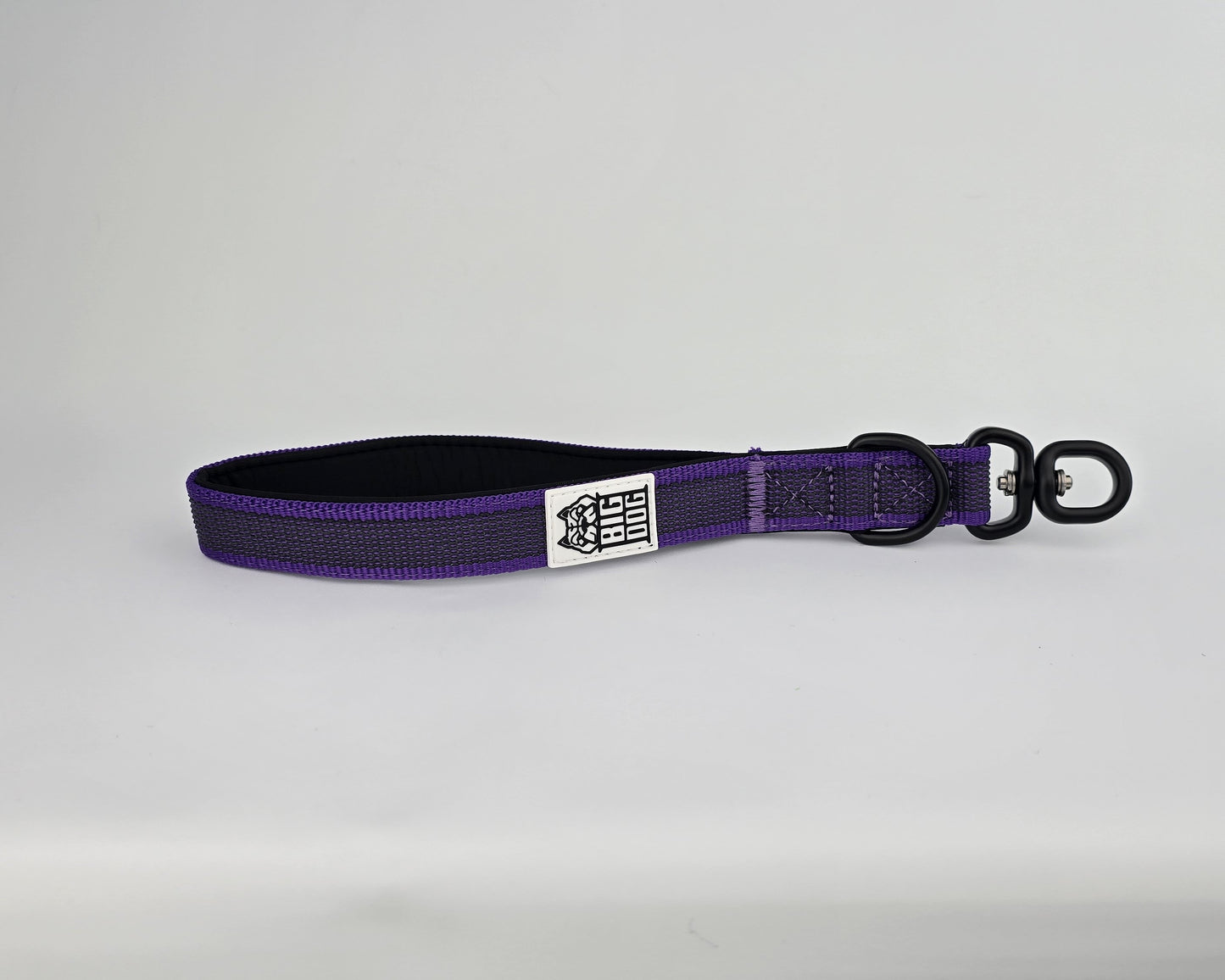 Purple and black dog handle with a The Big Dog Company logo. Neoprene, rubber, nylon. Heavy duty, high quality. 