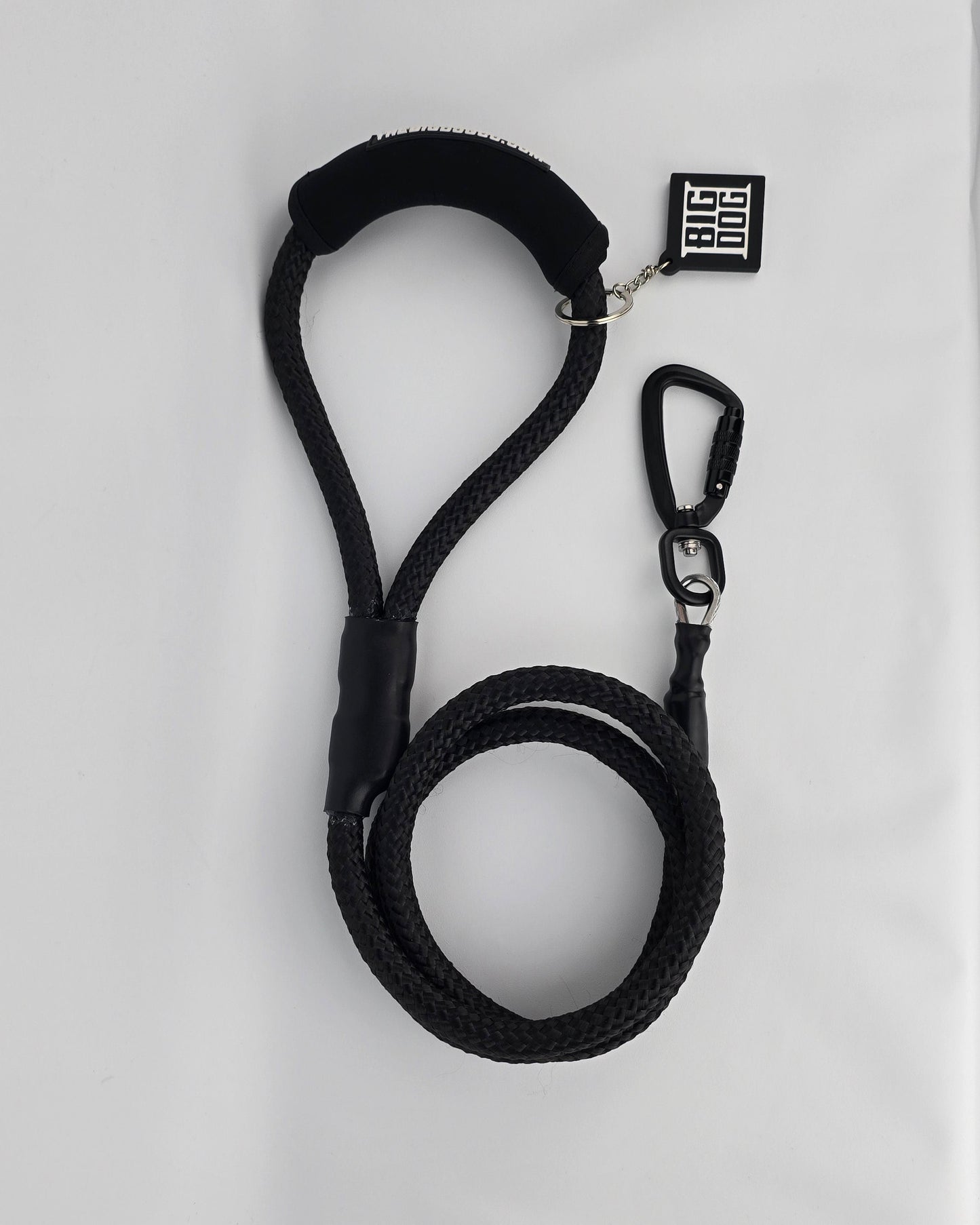 Black heavy duty climbing rope dog leash with swivel carabiner and neoprene handle. Internal steel cable, anti chew.